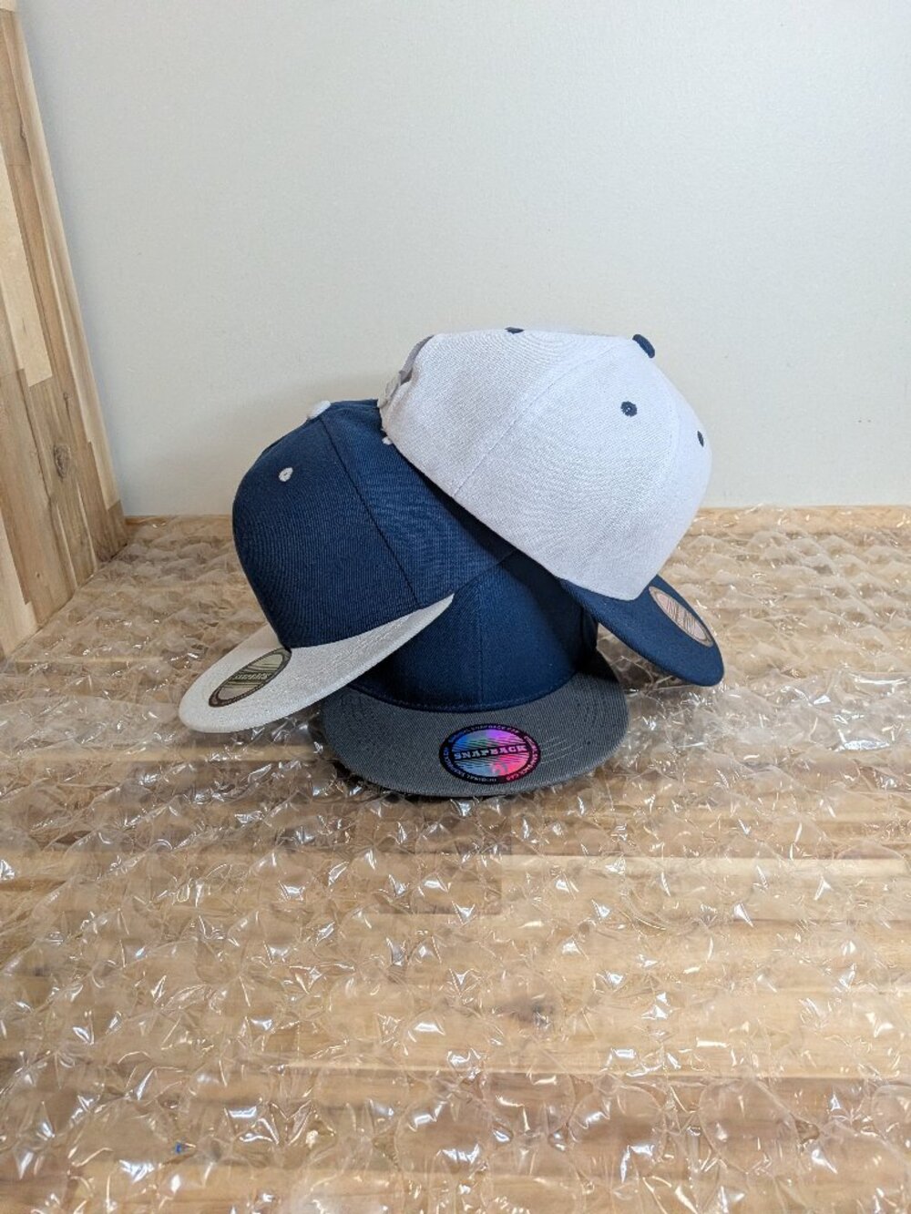 Blue and white baseball caps.